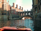 The Bridge of Sighs in Cambridge is a covered bridge belonging to St John's College of Cambridge University. It was built in 1831 and crosses the River Cam between the college's Third Court and New Court. Punting down the Cam is jolly fun, you can see the prow of the punt in the bottom of the picture.