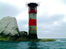 The Needles lighthouse, built in 1859, it has been automated since 1994. Perched on the end of the 'Needles' a row of three distinctive stacks of chalk that rise out of the sea off the western extremity of the Isle of Wight, England, close to Alum Bay.