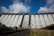 Water cascading over the dam with the sun directly behind me on a beautiful October morning. The noise of the water is awe inspiring.